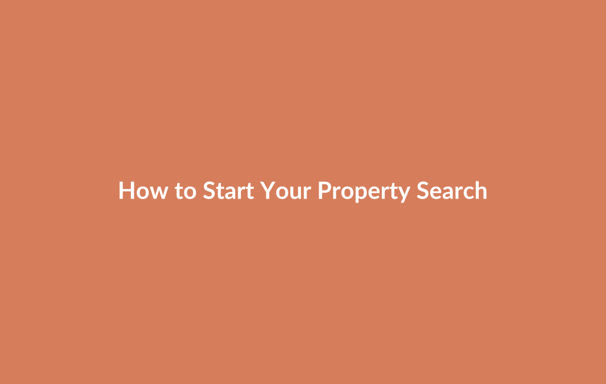 Person at home computer searching property listings and taking notes on desired areas